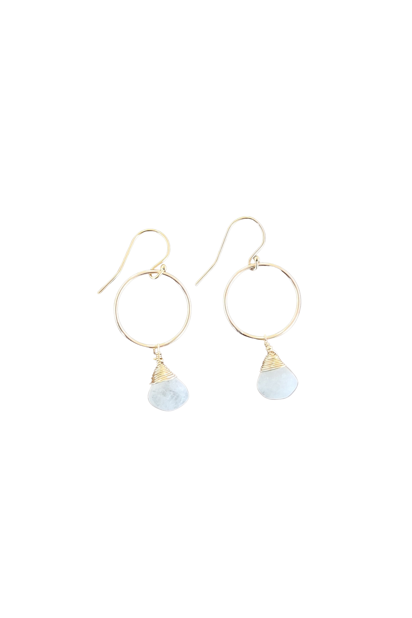 Gold hoop earrings with light blue teardrop charms on a white background