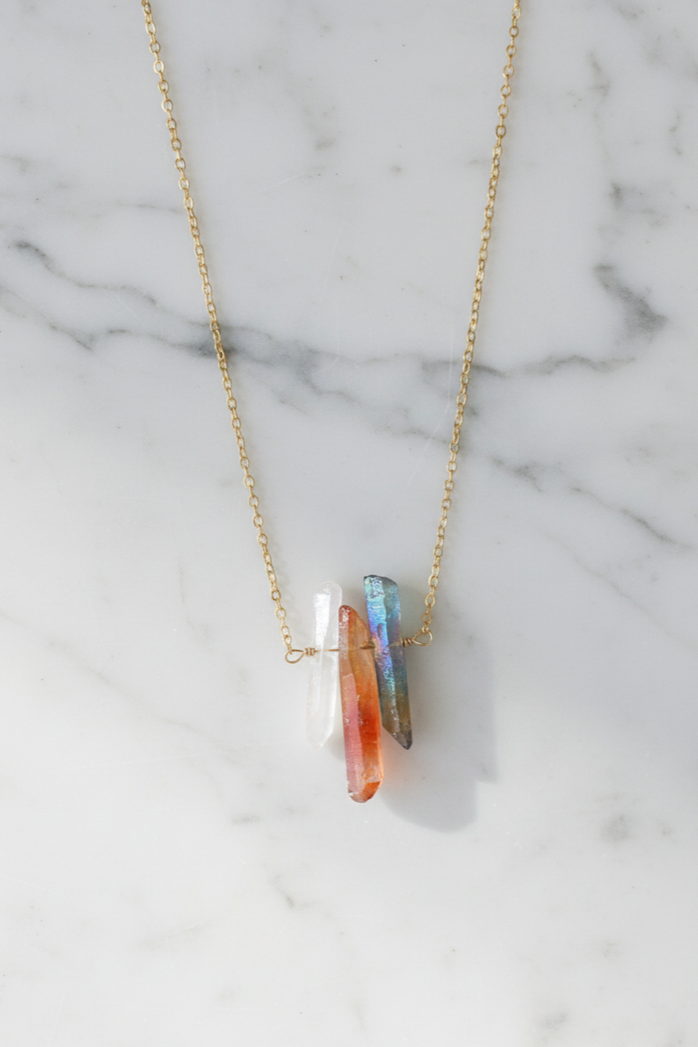 Necklace with a colorful pendant on a marble background