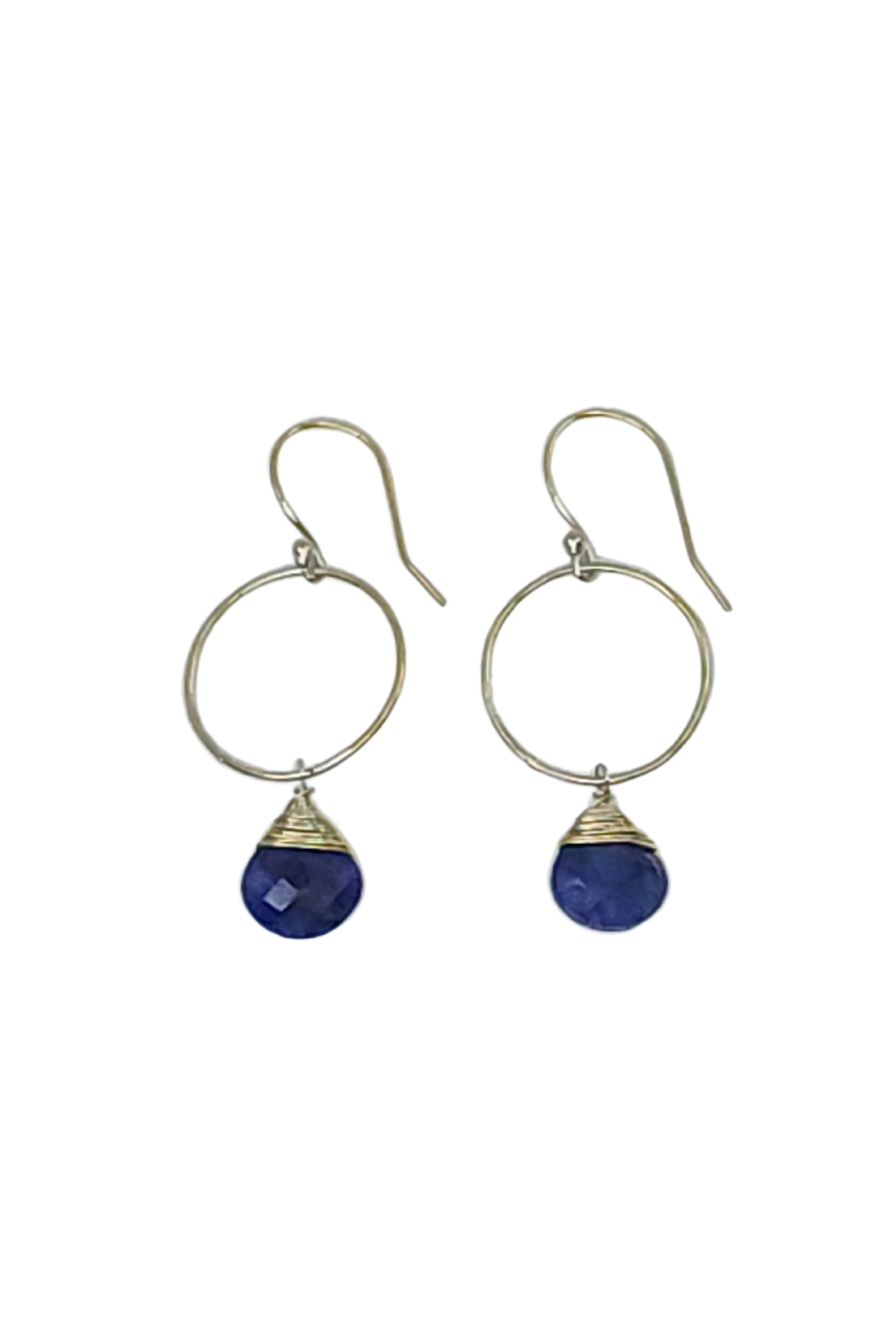 Pair of earrings with blue teardrop stones on a white background